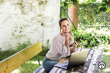 Women seated at a picnic table looking like she is about to meet someone