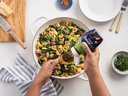 pic of woman making a pasta salad from overhead