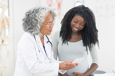 Doctor and patient discussing patients health in doctors office