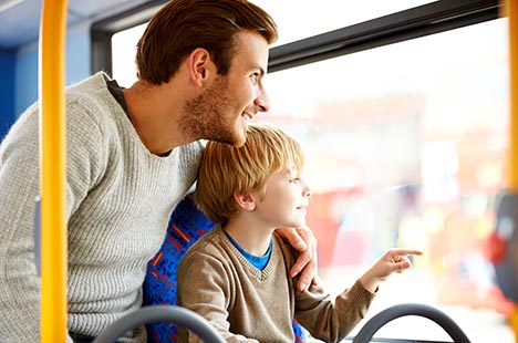 A father and his son riding on the train