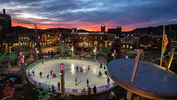 Outdoor, winter, nightime Rapid City, South Dakota city scape with ice skating rink